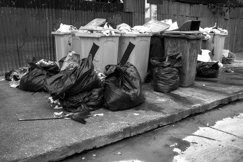 Rubbish removal team clearing household waste in a London street