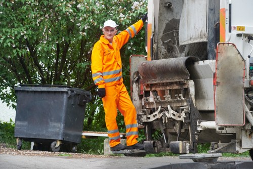 A local crew carrying out litter clearance near a London property entrance