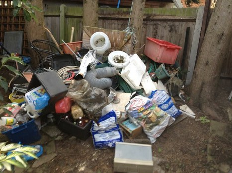 Clearance team handling a cluttered room in London with sensitivity and organisation